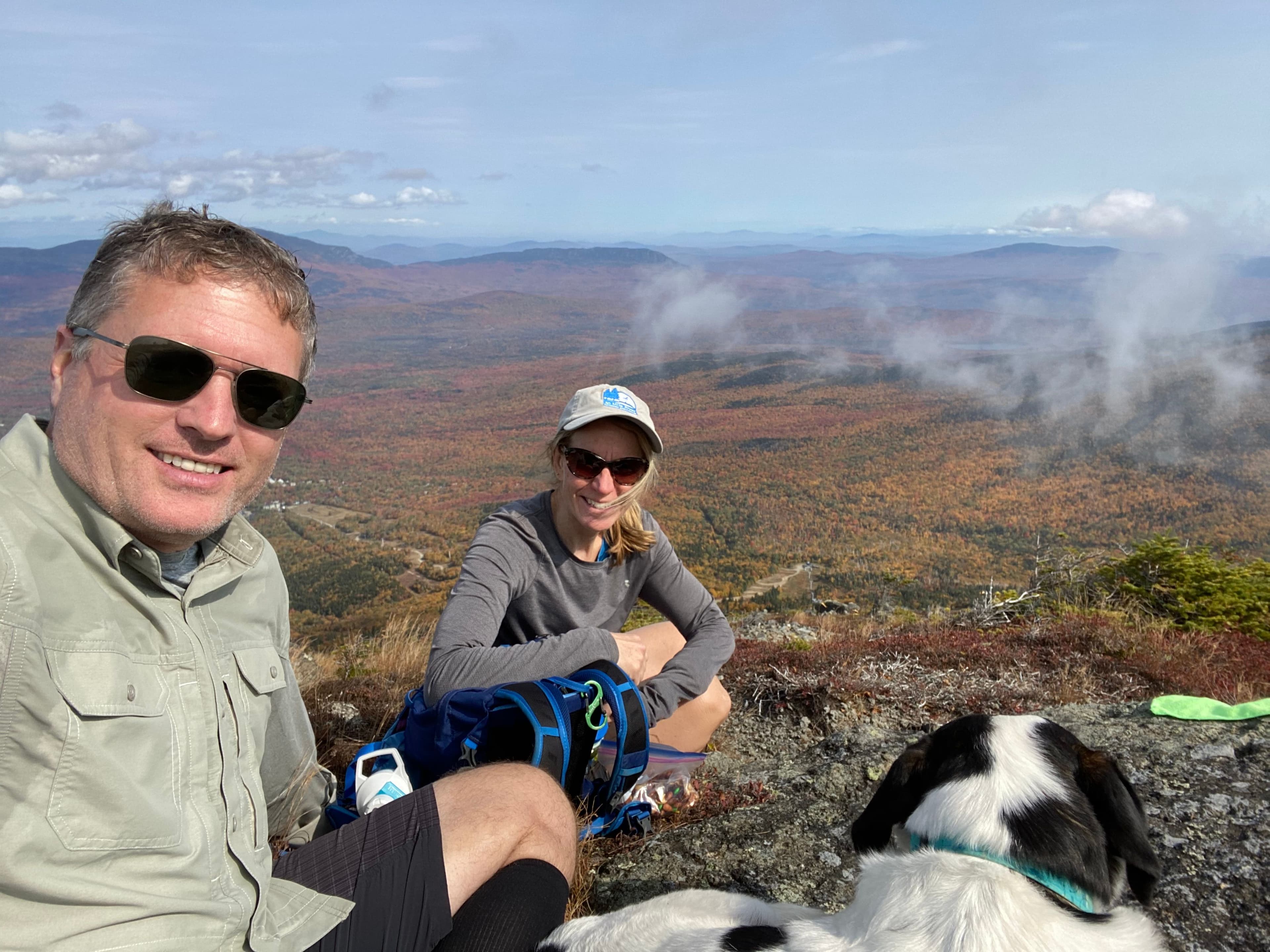 Fritz and Susan Onion stand on top of a mountain after a long hike.