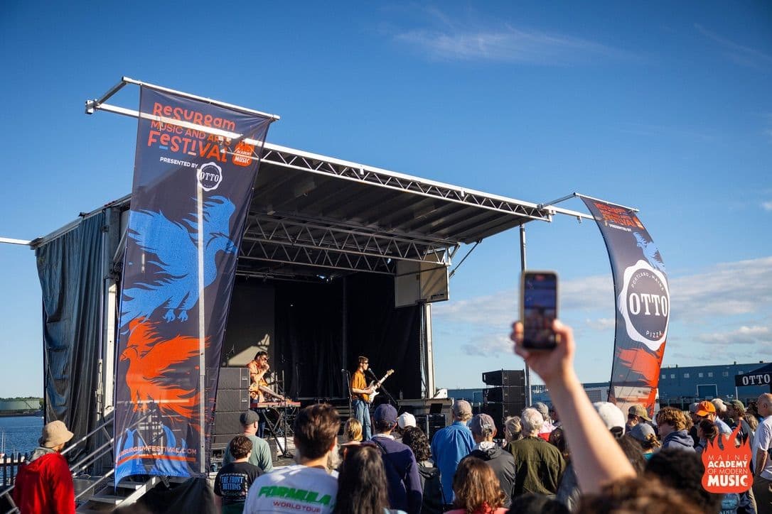 A student band plays to a large crowd on the main stage of the annual Resurgam Festival